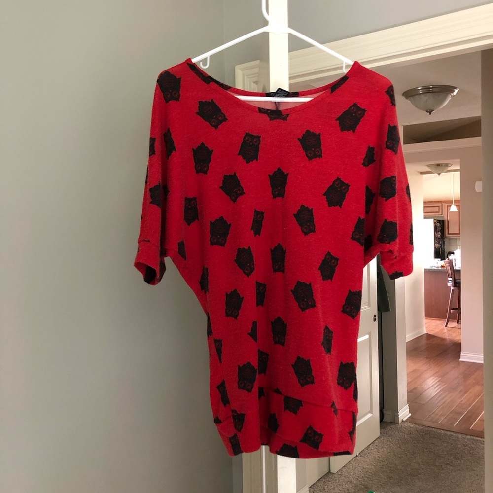 Red sweater with owl print